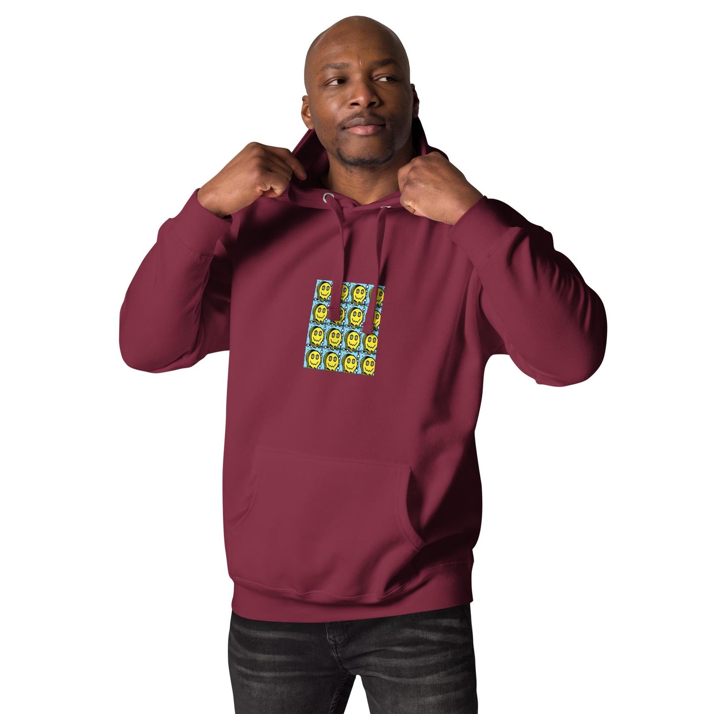 Male model wearing maroon Trashed Punk hoodie with neon smiley face chest graphic, urban streetwear style for mens rave wear and festival outfits.