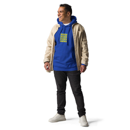 Male model wearing royal blue graphic hoodie styled with beige jacket, casual streetwear look for mens rave outfits and urban fashion.