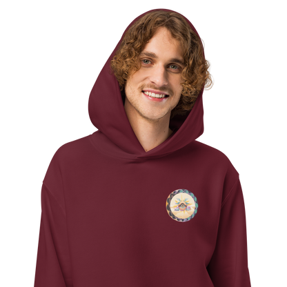 Male model in maroon oversized hoodie, eco-friendly streetwear style for mens festival outfits and cool graphic hoodies.